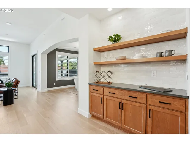 a view of kitchen with cabinets and wooden floor