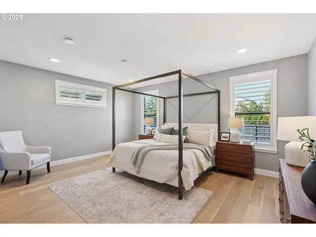 a bedroom with a bed and a chair