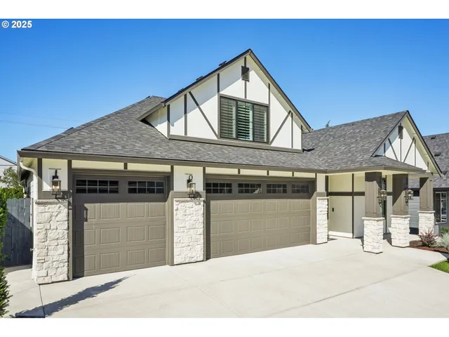 a front view of a house with a garage
