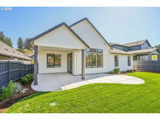 a front view of a house with a yard and porch