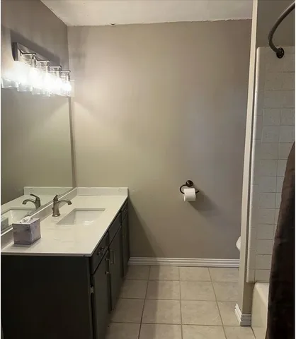 a bathroom with a sink and mirror