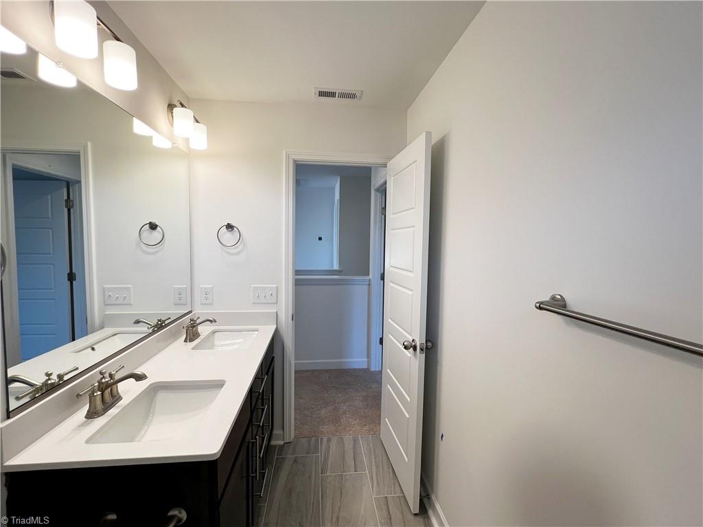 7707 Sedgewick Ridge Road Lewisville, NC 27023 - Photo 24 of 35 Upstairs Full Bath w/ Double Vanity