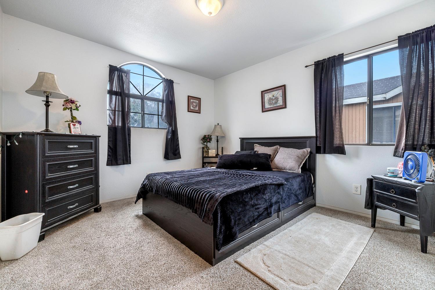 1592 North Ferger Avenue Fresno, CA 93728 - Photo 19 of 30 a living room with a bed furniture and a window