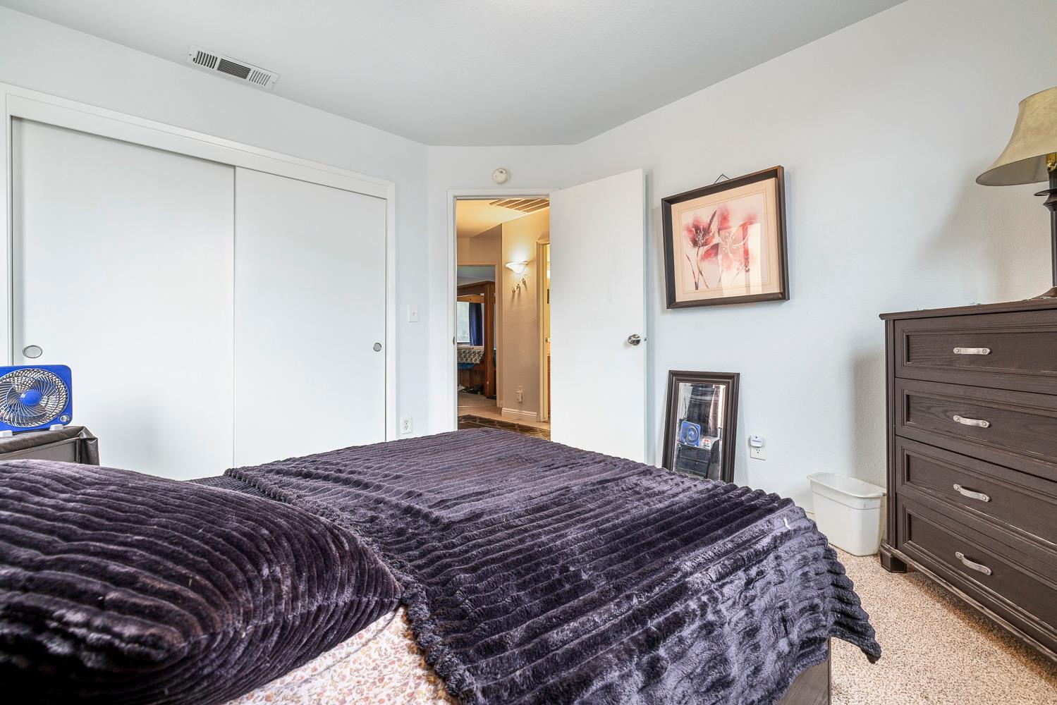 1592 North Ferger Avenue Fresno, CA 93728 - Photo 20 of 30 a bedroom with a bed and a dresser