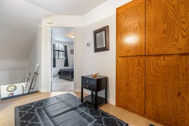 a bedroom with a bed and a table in it