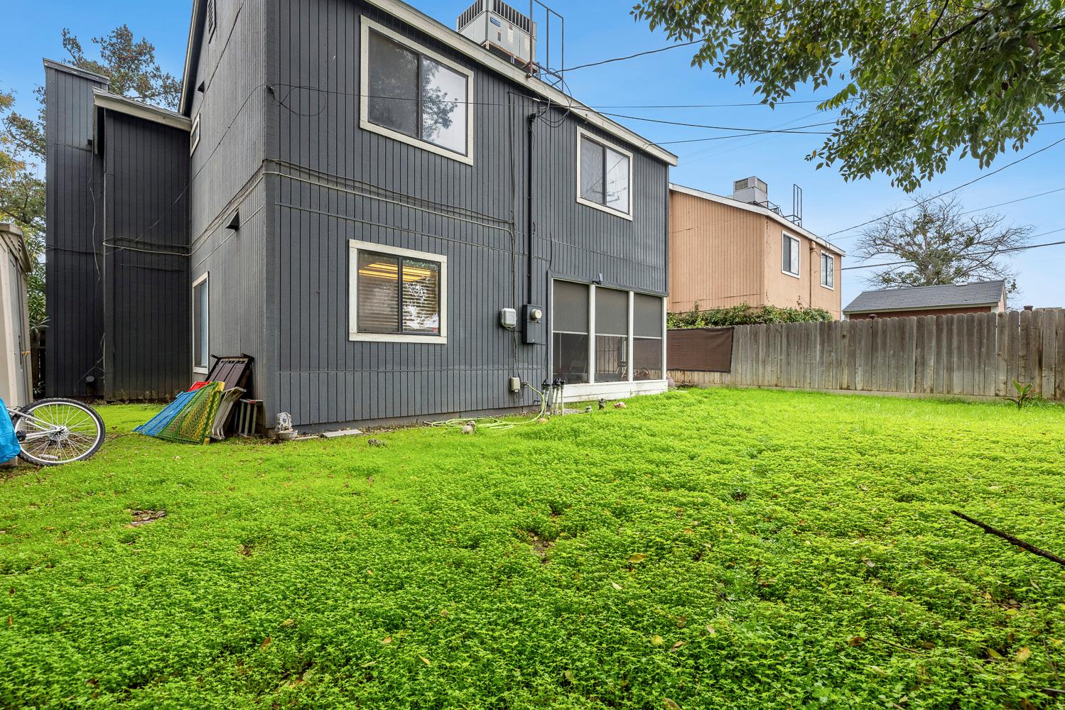 1592 North Ferger Avenue Fresno, CA 93728 - Photo 28 of 30 a view of a house with backyard and a tree