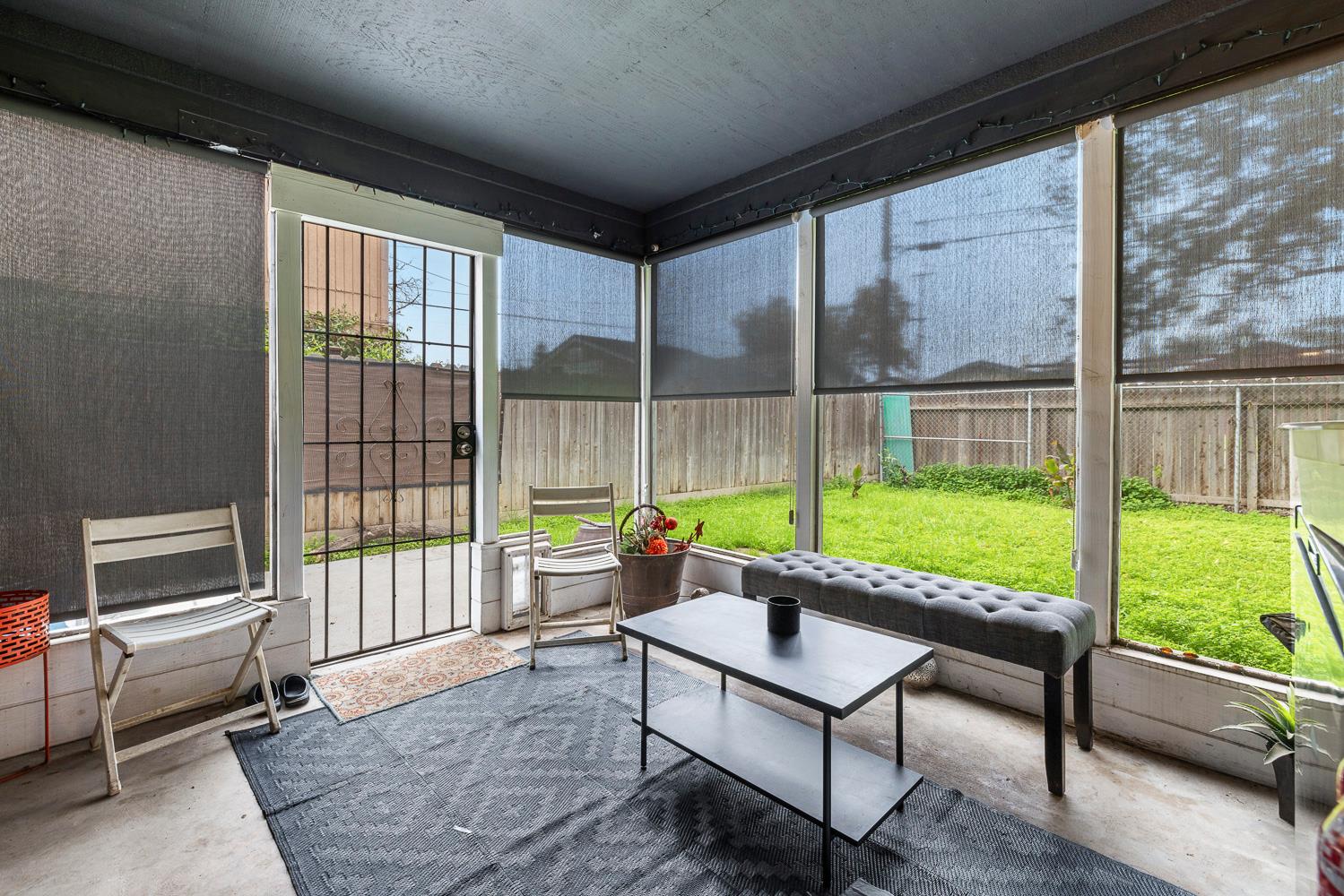 1592 North Ferger Avenue Fresno, CA 93728 - Photo 5 of 30 a view of a patio with a table chairs and a backyard
