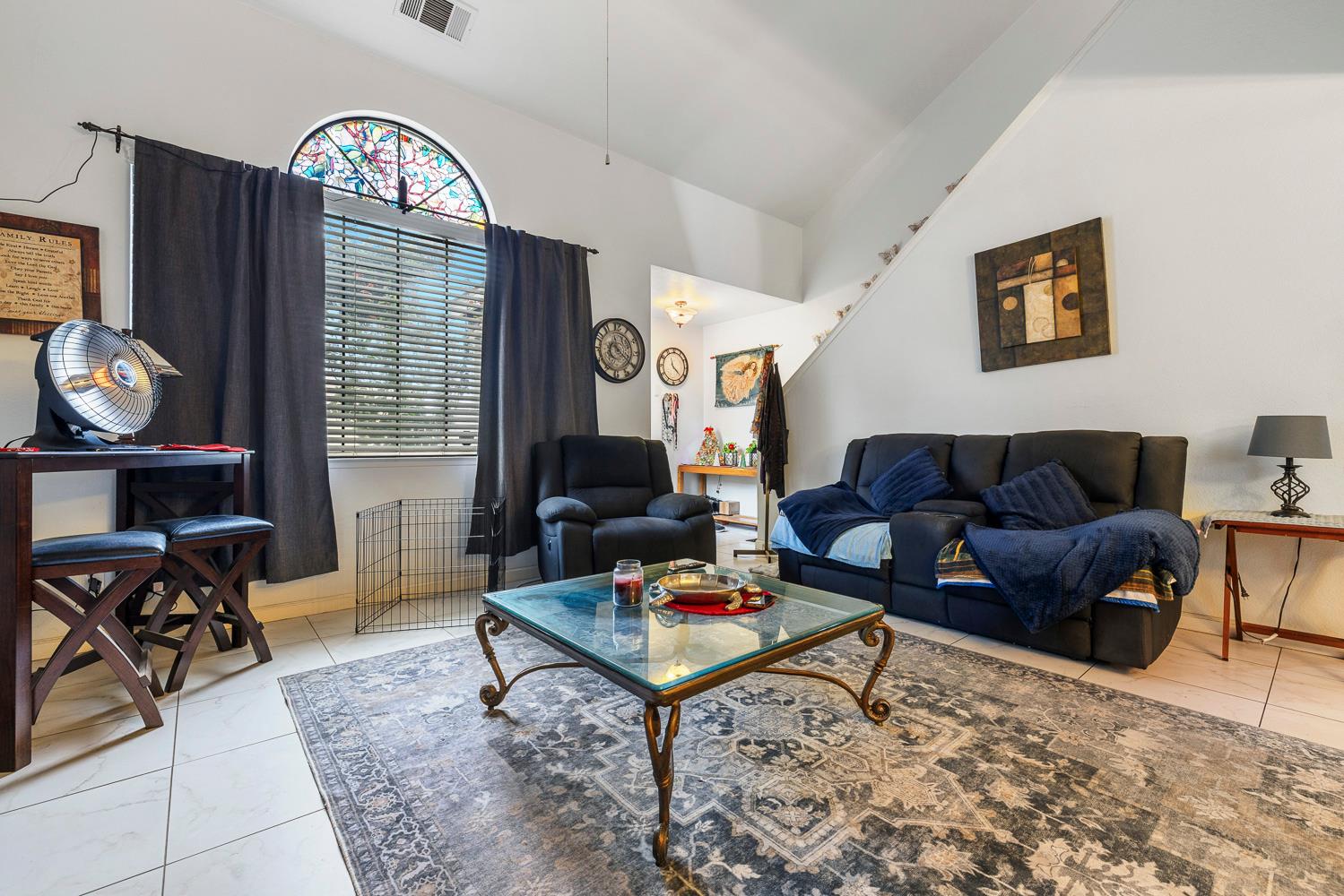 1592 North Ferger Avenue Fresno, CA 93728 - Photo 7 of 30 a living room with furniture a rug and a window