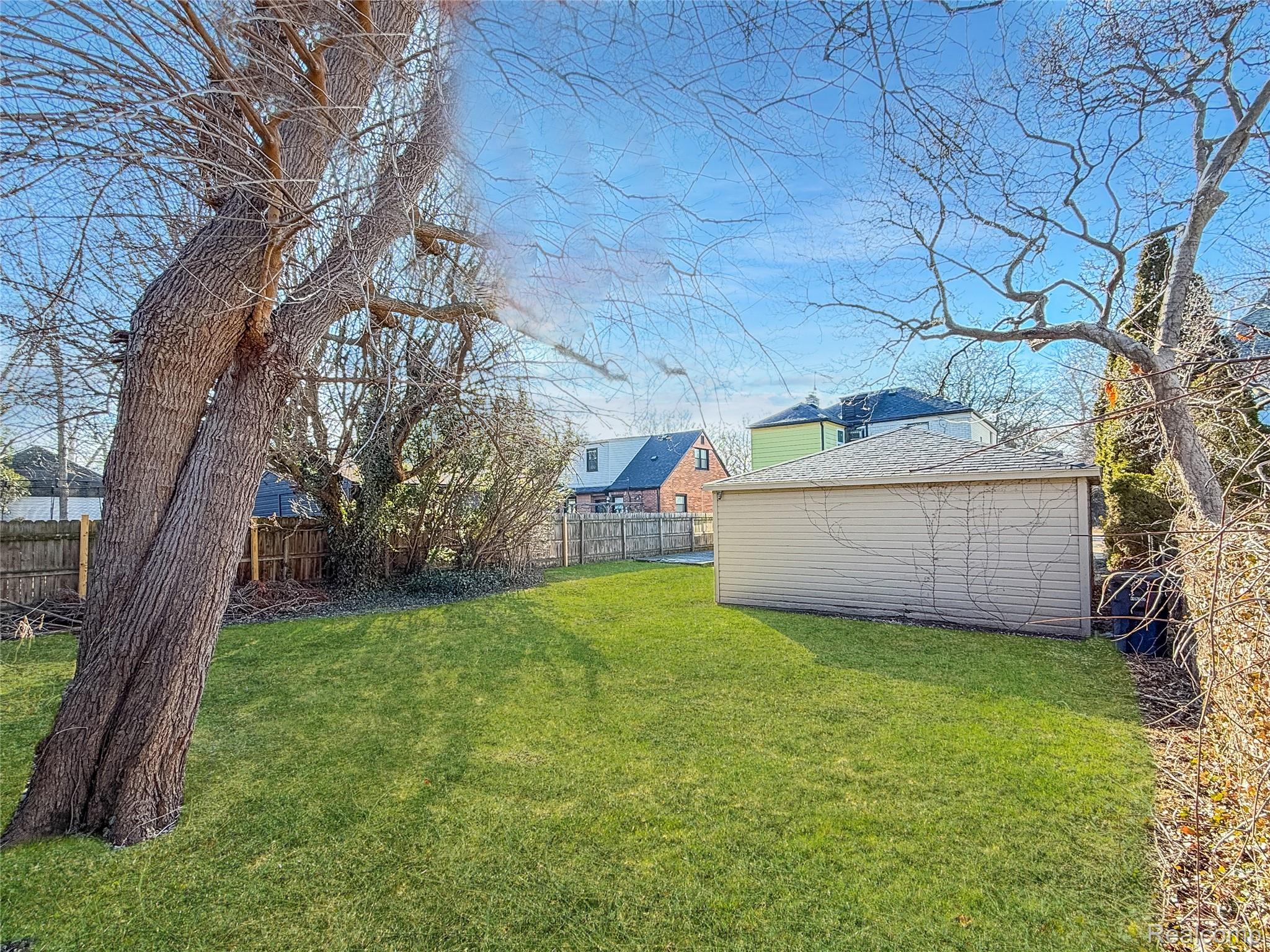768 Washington Road Grosse Pointe, MI 48230 - Photo 35 of 54 View of fenced backyard. This photo has been digitally enhanced.
