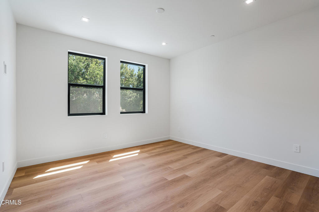2821 Los Robles Road Thousand Oaks, CA 91362 - Photo 36 of 68 a view of an empty room with wooden floor and a window