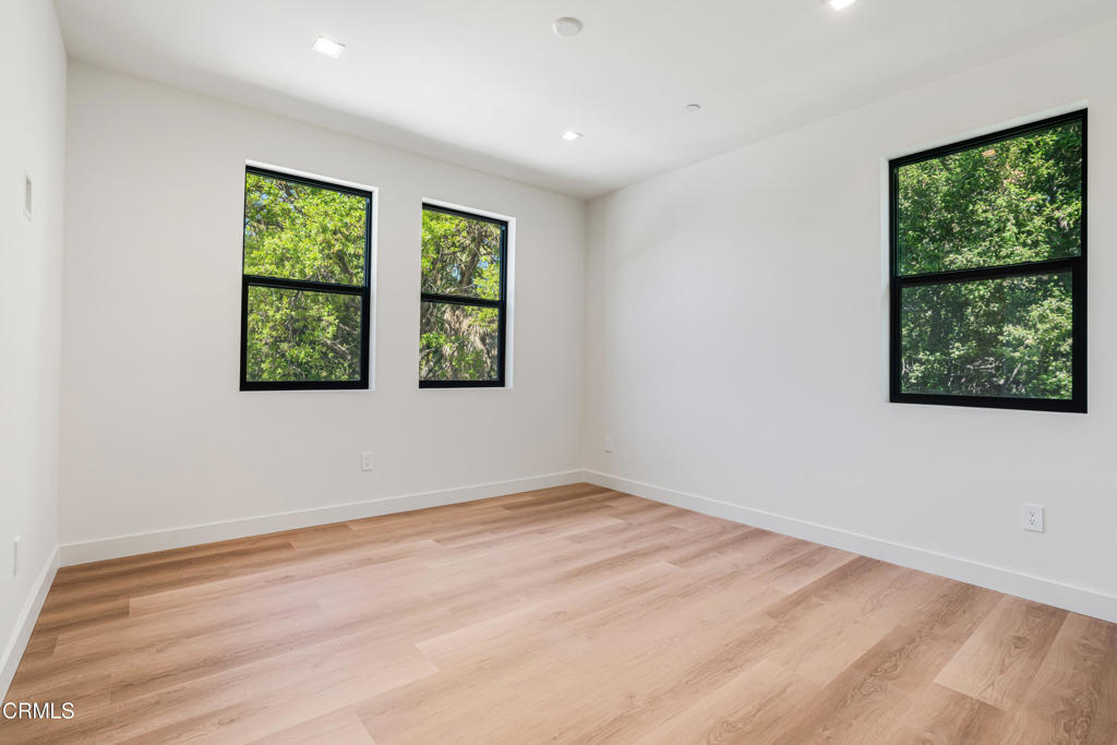 2821 Los Robles Road Thousand Oaks, CA 91362 - Photo 38 of 68 a view of an empty room with a window and wooden floor