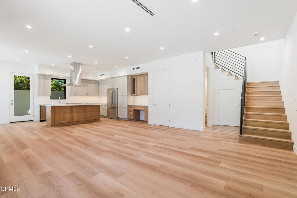 2821 Los Robles Road Thousand Oaks, CA 91362 - Photo 47 of 68 a view of an empty room with a fireplace and stairs