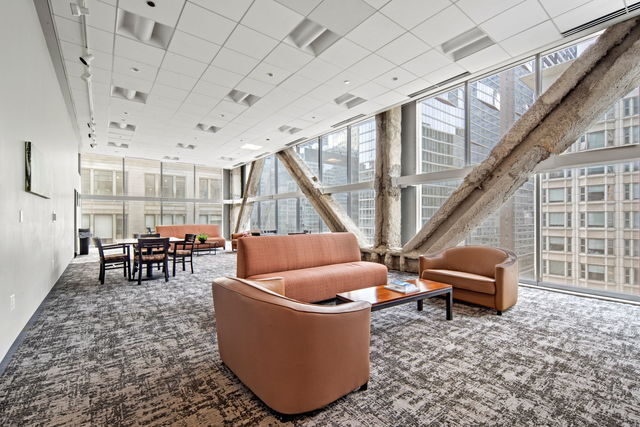 8 East Randolph Street, Unit 3004 Chicago, IL 60601 - Photo 18 of 20 a living room with furniture and a dining table