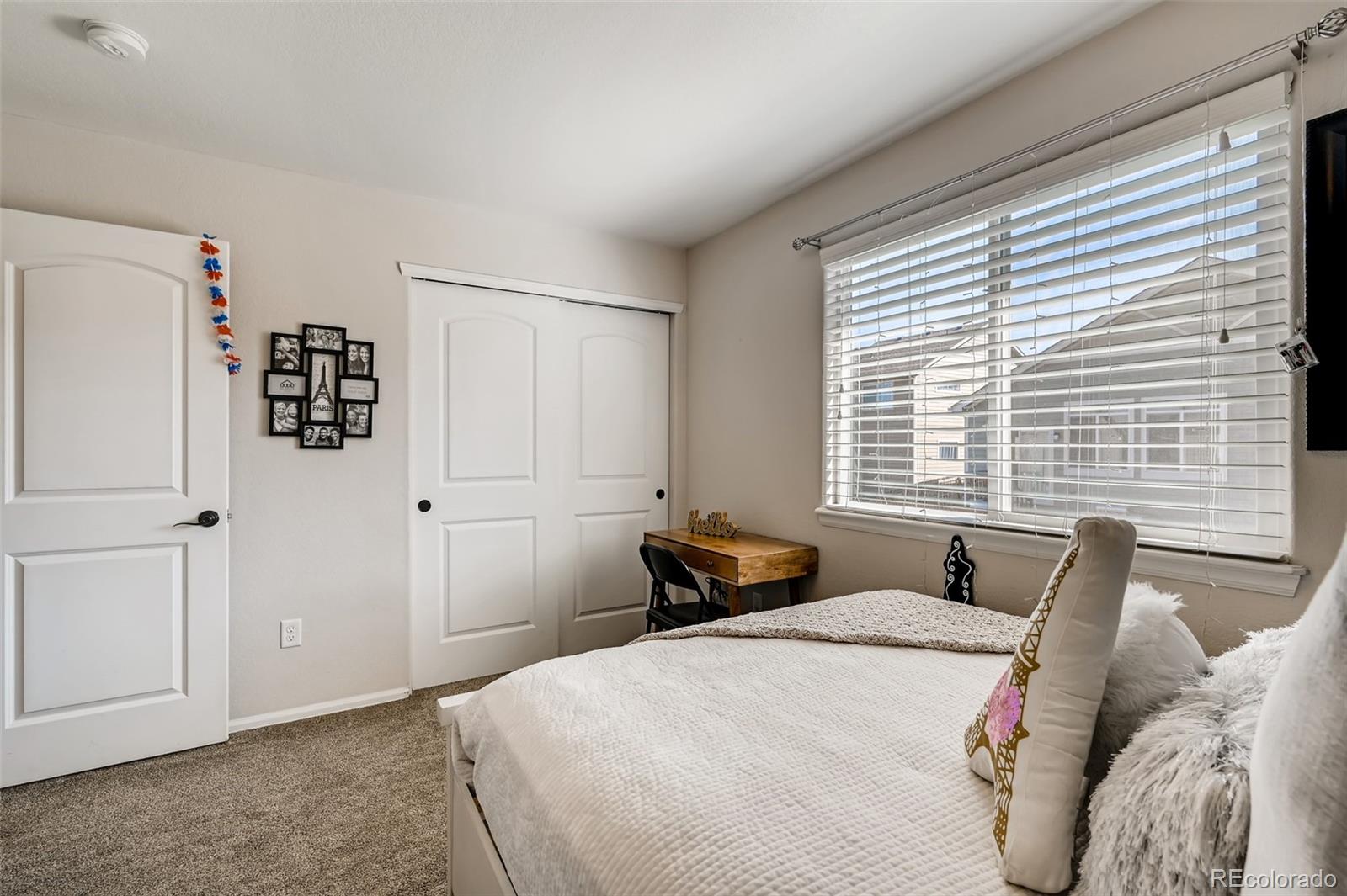 465 Territory Lane Johnstown, CO 80534 - Photo 11 of 24 a bedroom with a bed and a window