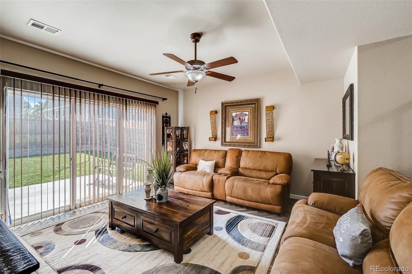465 Territory Lane Johnstown, CO 80534 - Photo 14 of 24 a living room with furniture and a large window