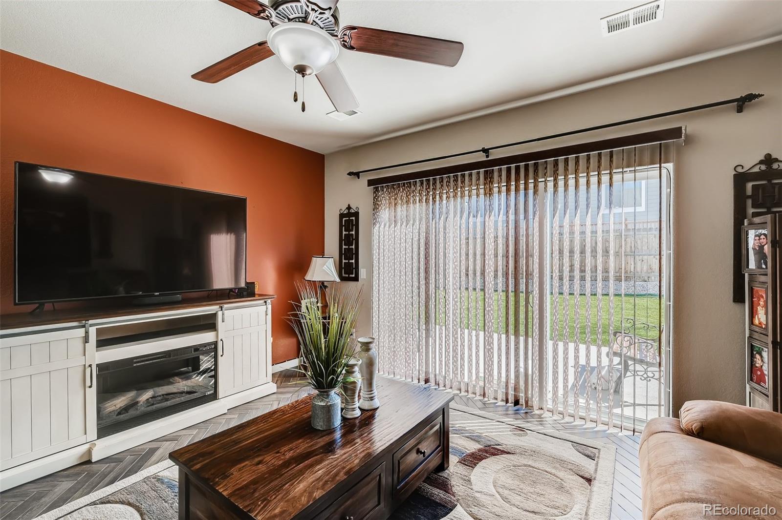 465 Territory Lane Johnstown, CO 80534 - Photo 15 of 24 a living room with furniture and a flat screen tv