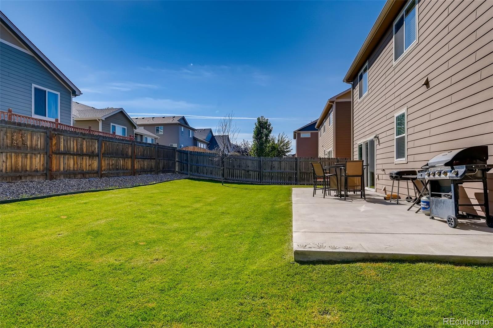 465 Territory Lane Johnstown, CO 80534 - Photo 18 of 24 a view of a house with a swimming pool