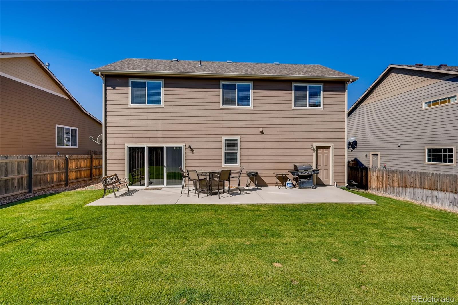 465 Territory Lane Johnstown, CO 80534 - Photo 20 of 24 a view of a house with backyard and sitting area