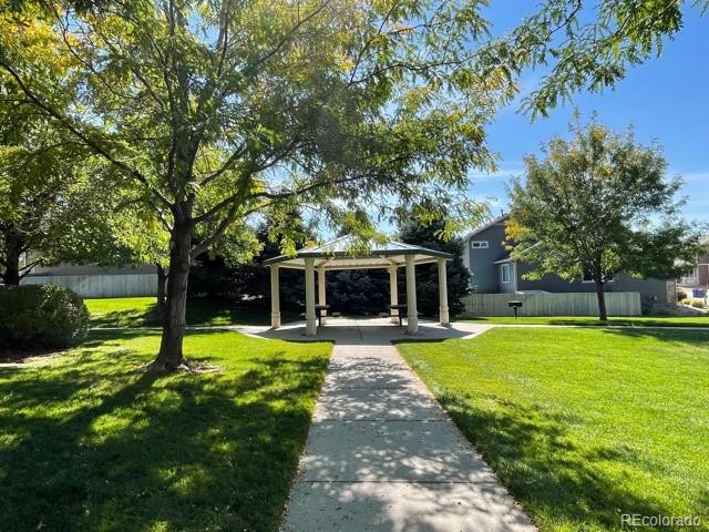 465 Territory Lane Johnstown, CO 80534 - Photo 23 of 24 a view of a house with swimming pool and a yard