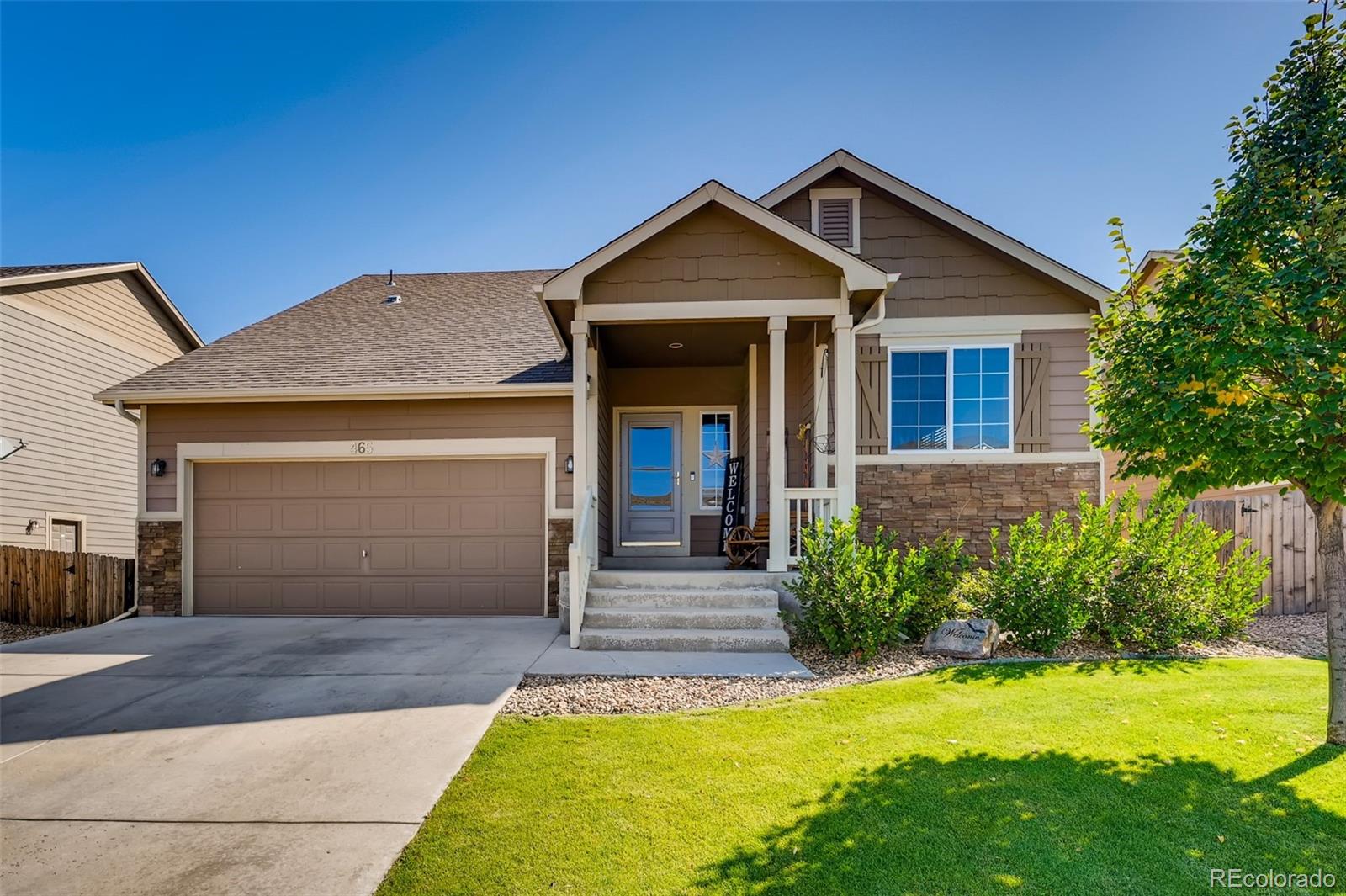 465 Territory Lane Johnstown, CO 80534 - Photo 3 of 24 a front view of a house with yard