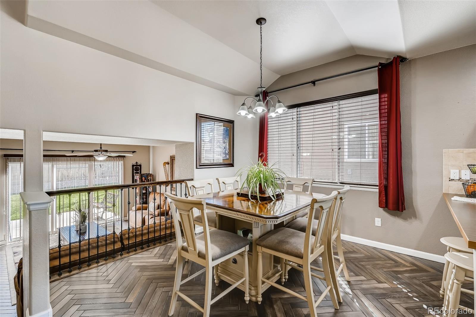 465 Territory Lane Johnstown, CO 80534 - Photo 4 of 24 a view of a dining room with furniture and chandelier