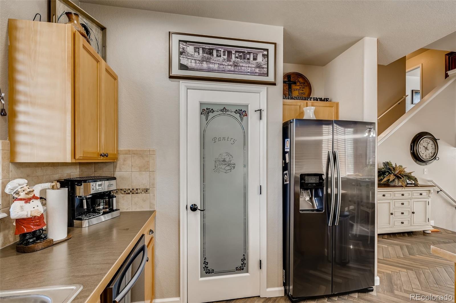 465 Territory Lane Johnstown, CO 80534 - Photo 7 of 24 a view of a kitchen with fridge and stove