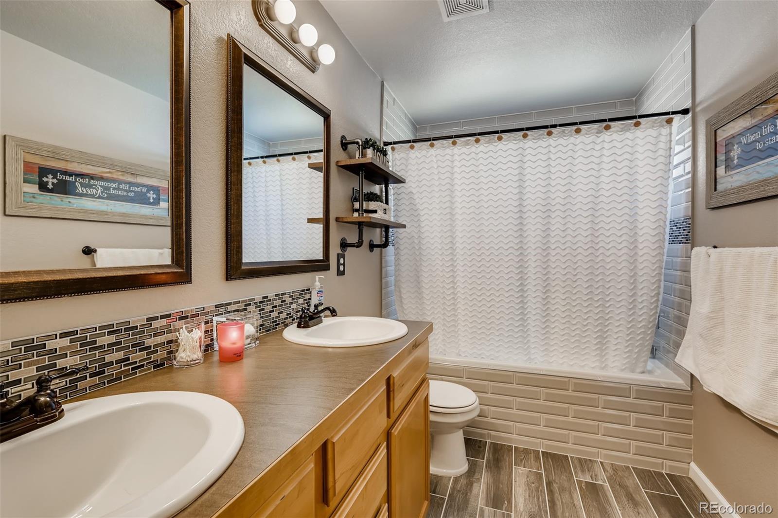 465 Territory Lane Johnstown, CO 80534 - Photo 10 of 24 a bathroom with a sink and a mirror