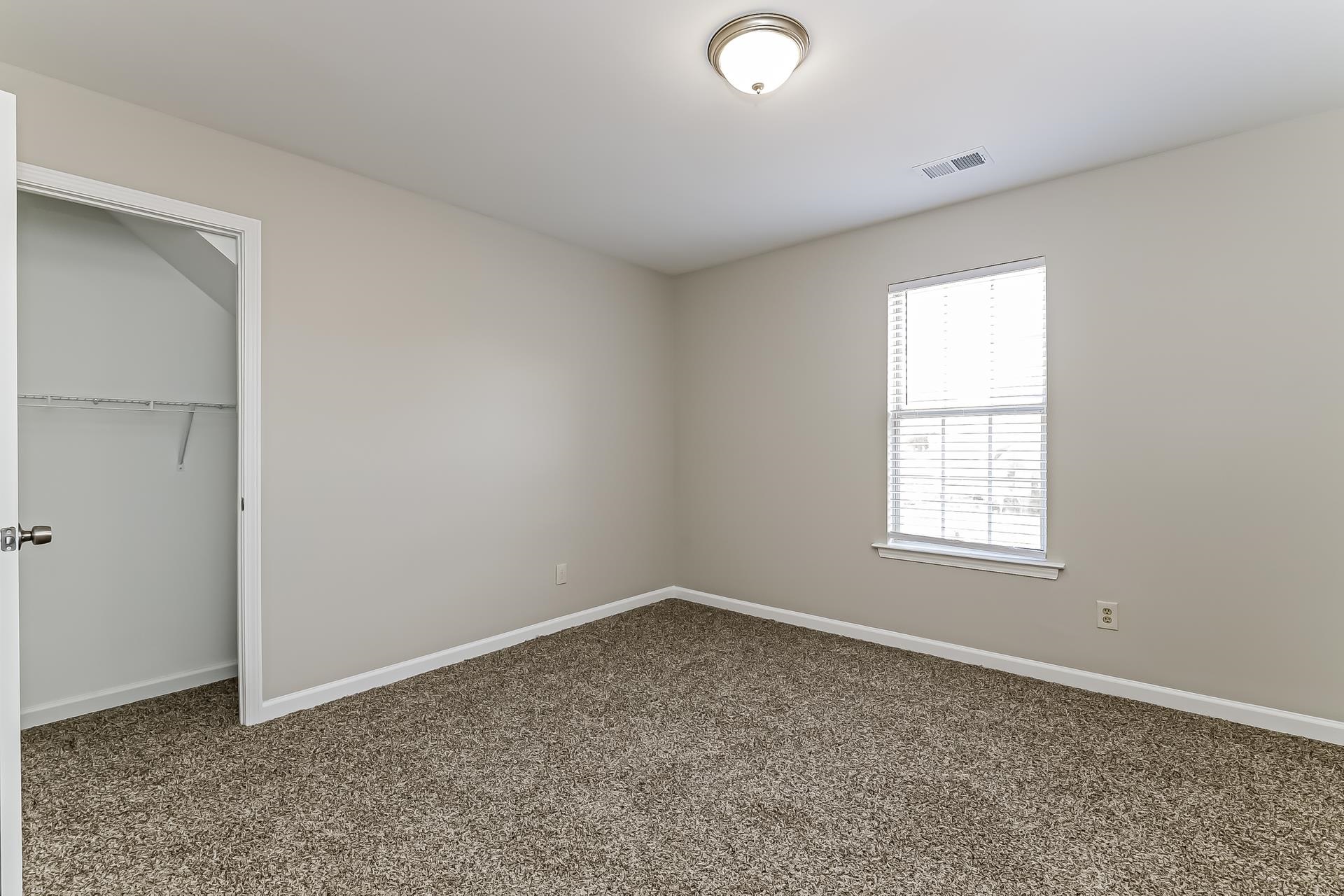 5377 Ragan Ridge Drive Memphis, TN 38141 - Photo 11 of 17 an empty room with a window