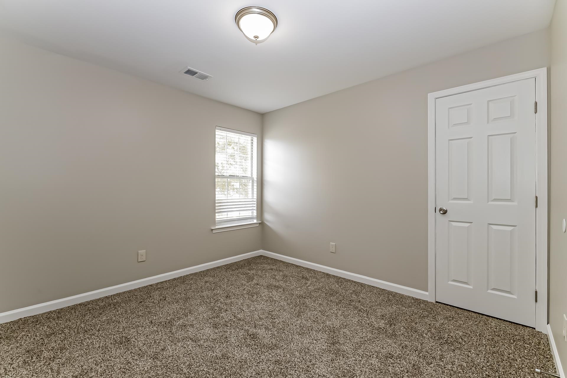 5377 Ragan Ridge Drive Memphis, TN 38141 - Photo 13 of 17 an empty room with windows