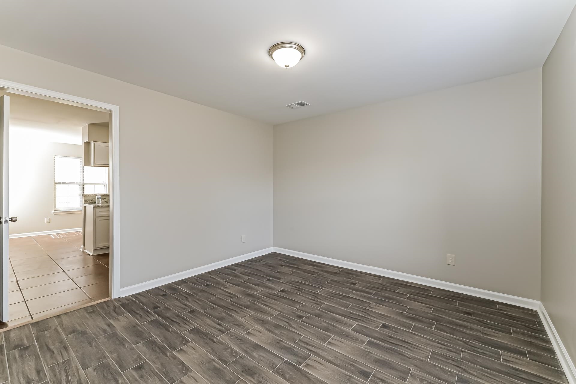5377 Ragan Ridge Drive Memphis, TN 38141 - Photo 4 of 17 a view of an empty room with wooden floor
