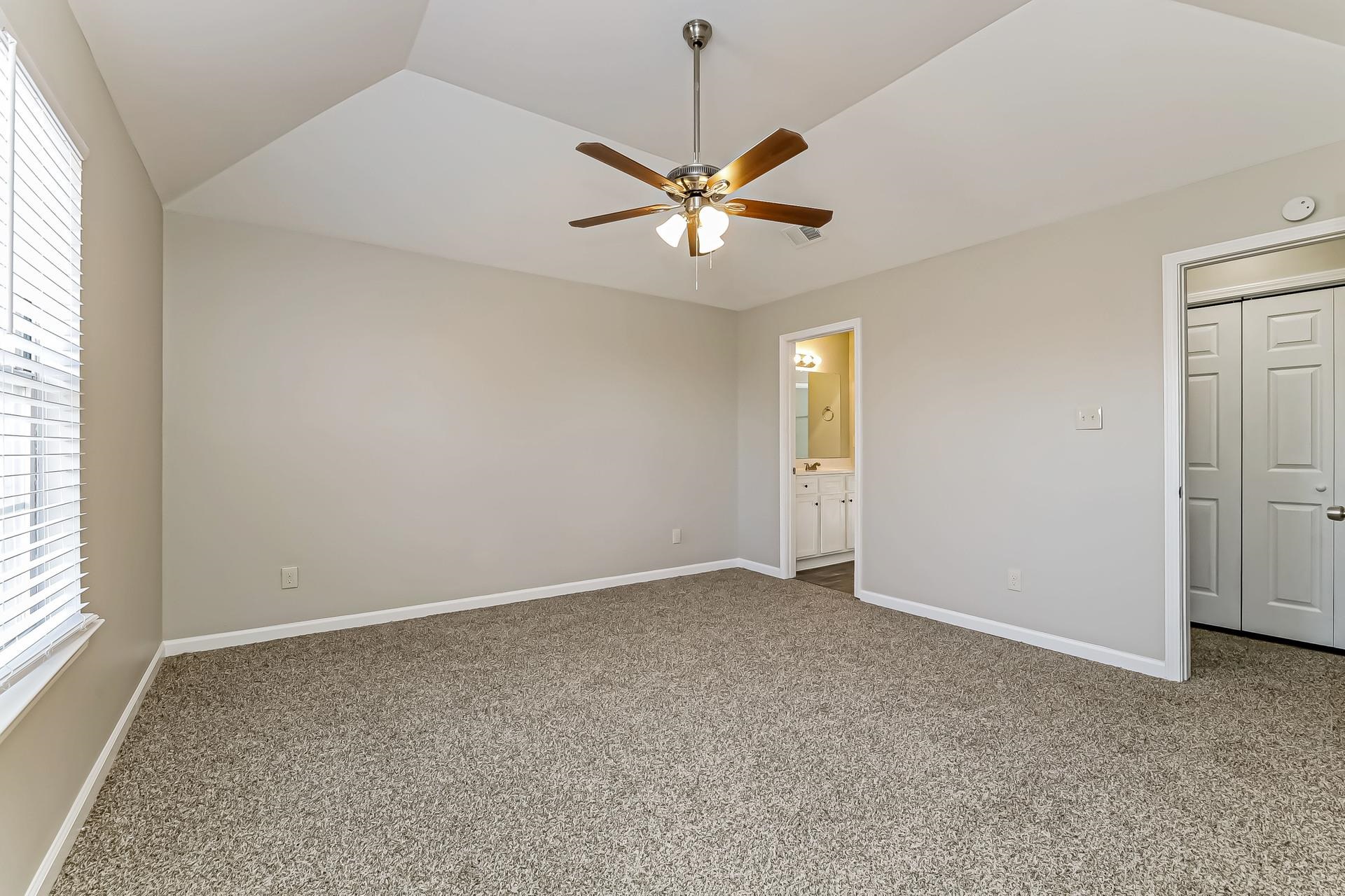 5377 Ragan Ridge Drive Memphis, TN 38141 - Photo 8 of 17 an empty room with fan and windows