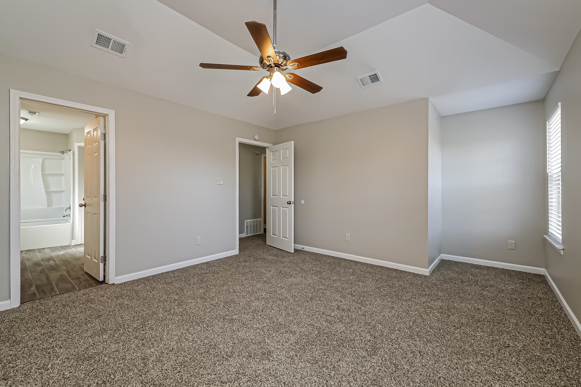 5377 Ragan Ridge Drive Memphis, TN 38141 - Photo 9 of 17 an empty room with closet and windows