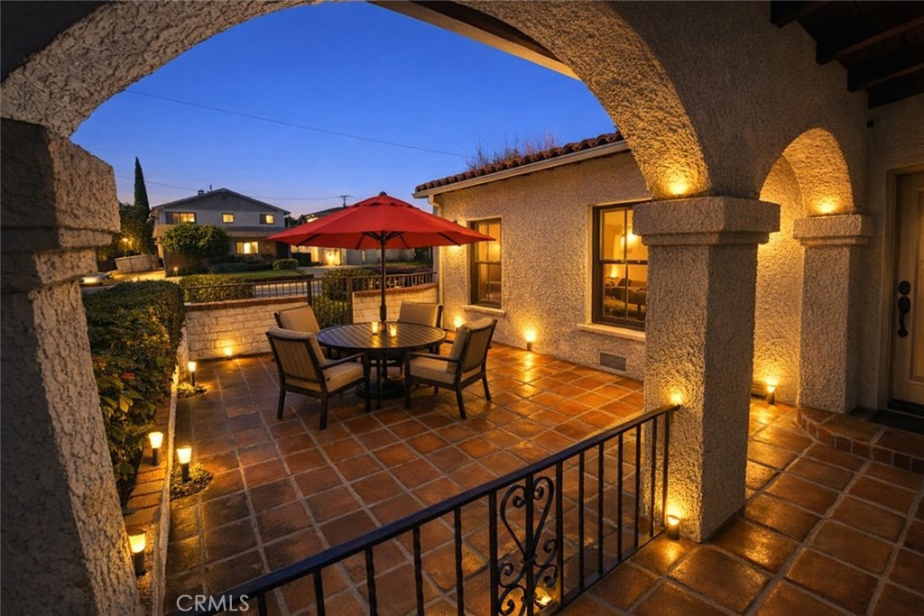 1028 San Rafael Avenue Glendale, CA 91202 - Photo 3 of 17 a view of a patio with table and chairs with wooden floor and fence