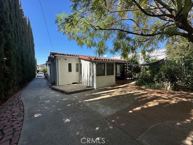 1028 San Rafael Avenue Glendale, CA 91202 - Photo 6 of 17 a view of a white house with a large tree