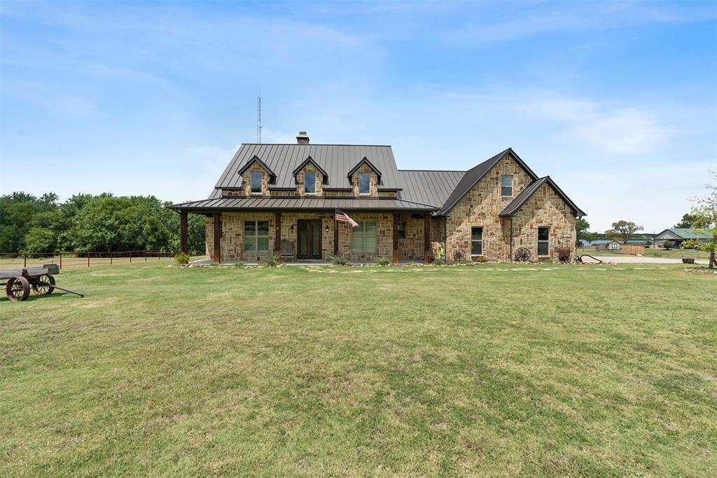 4180 North Smith Road Fate, TX 75087 - Photo 2 of 27 a front view of a house with garden