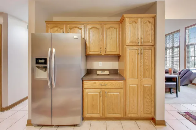 a bedroom with furniture and large windows