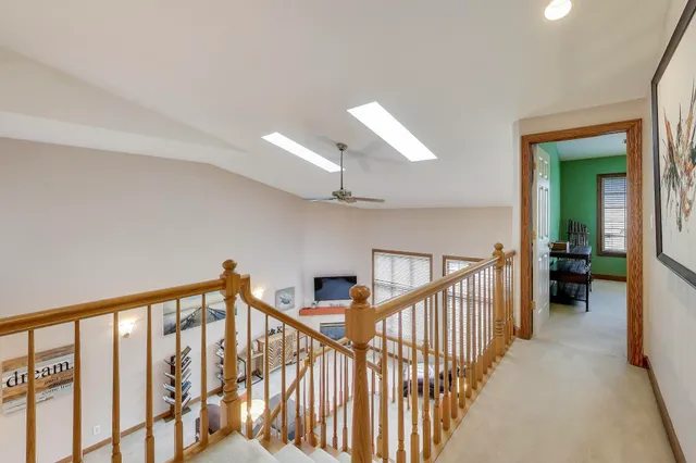 a bedroom with furniture and a flat screen tv