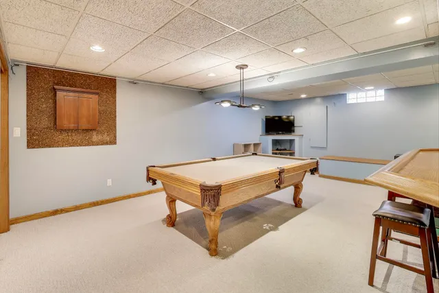 a room with lots of furniture and a chandelier