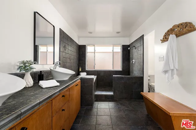 a kitchen with granite countertop a sink and a stove