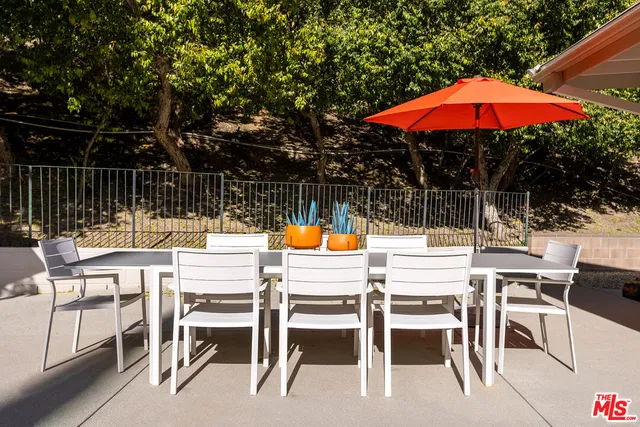 a view of chairs and tables in a patio