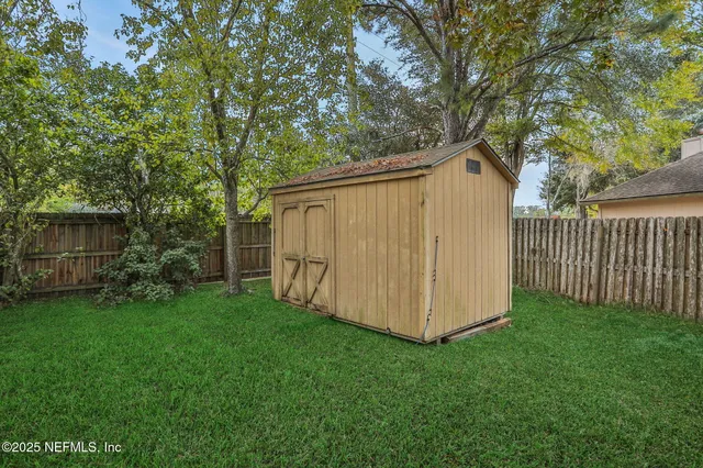 a backyard of a house with lots of green space