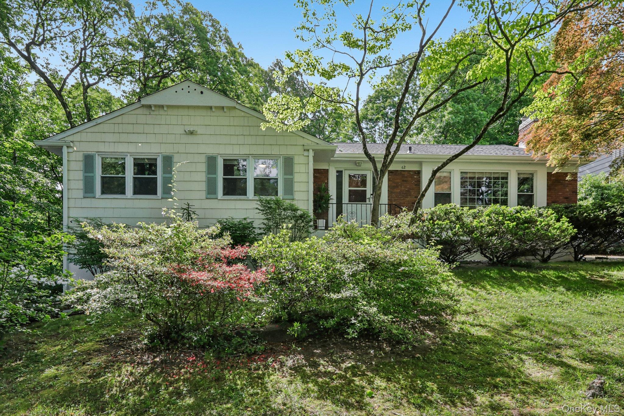 62 Mohegan Road Larchmont, NY 10538 - Photo 1 of 46 front view of a house with a yard