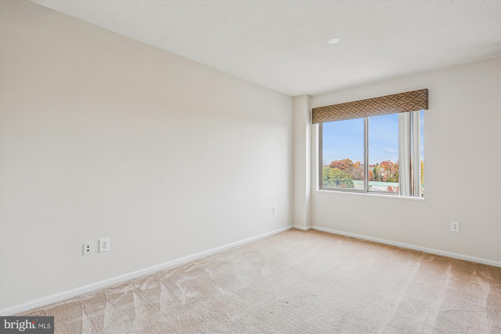 3210 North Leisure World Boulevard, Unit 610 Silver Spring, MD 20906 - Photo 43 of 97 an empty room with windows
