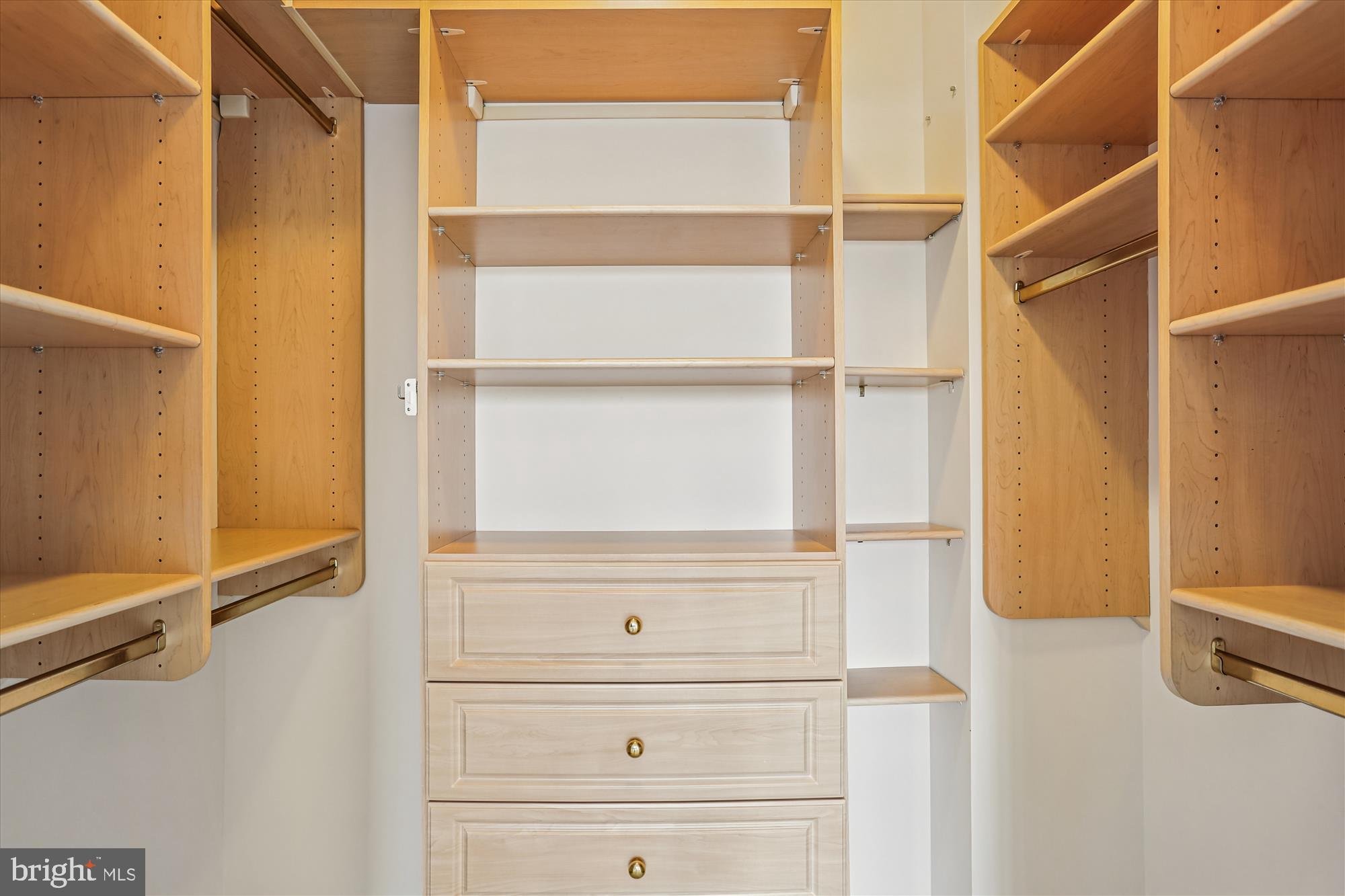 3210 North Leisure World Boulevard, Unit 610 Silver Spring, MD 20906 - Photo 47 of 97 a view of walk in closet with empty racks