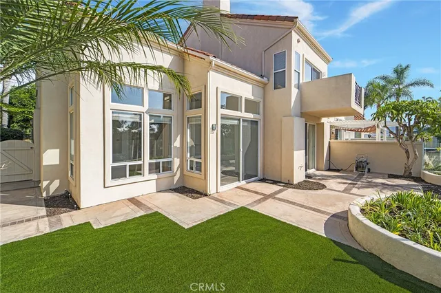 a view of a house with a yard and plants