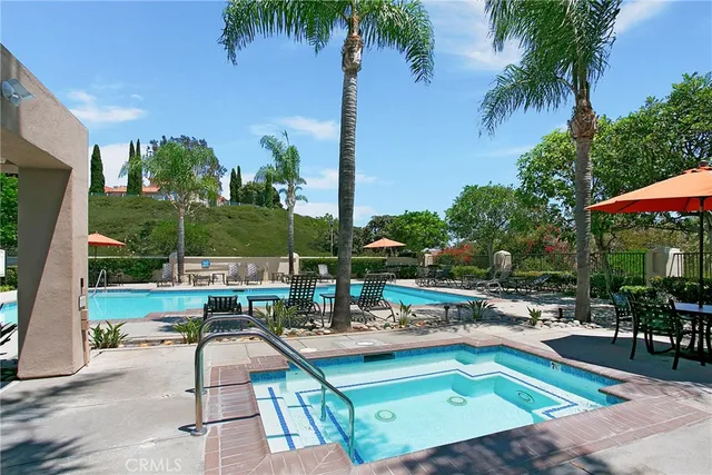 a view of a swimming pool with chairs