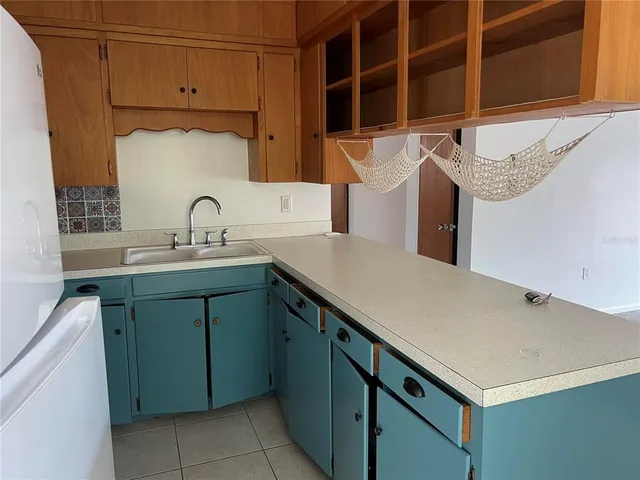 a kitchen with a sink and a cabinets