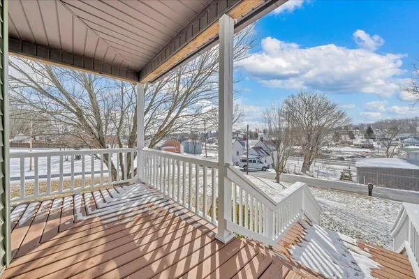 a view of a porch with wooden fence