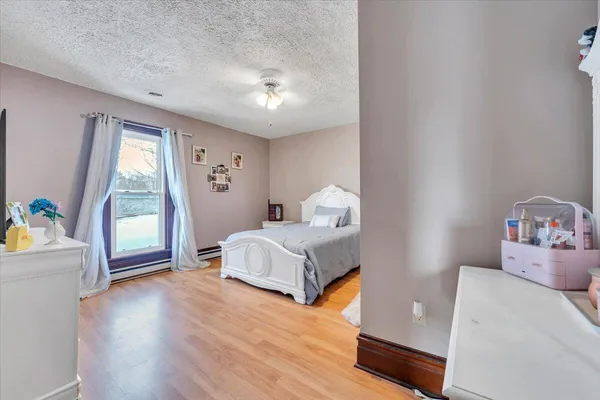 a bedroom with a bed and a view of bedroom