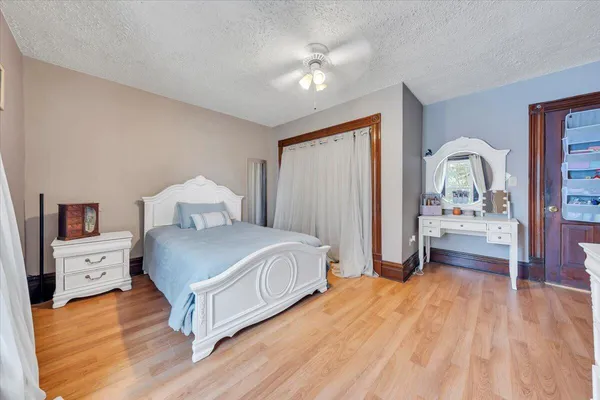 a bed room with a bed and a dresser